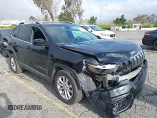 2019 Jeep Cherokee Latitude with VIN 1C4PJLCB8KD215423, listed as a IAAI auction lot 41911882 with 76,965 mi miles. Bid and sale history available at carsss.com. Image 1.