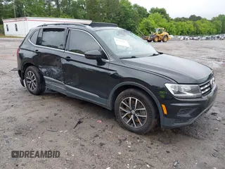 2021 Volkswagen Tiguan SE z VIN 3VV3B7AX6MM021502, wystawiony jako IAAI lot #42243705 z przebiegiem 60 988 mil mil oraz . Historia ofert i sprzedaży dostępna na DreamBid. Obrazek 1.