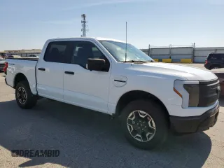 2023 Ford F-150 Lightning Pro with VIN 1FT6W1EVXPWG44972, listed as a Copart auction lot 60303485 with 19,788 mi miles and Salvage title. Bid and sale history available at DreamBid. Image 4.