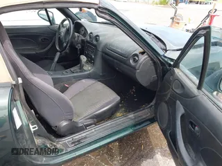 2002 Mazda MX-5 Miata Cloth z VIN JM1NB353720222073, wystawiony jako IAAI lot #42225042 z przebiegiem 94 992 mil mil oraz . Historia ofert i sprzedaży dostępna na DreamBid. Obrazek 5.