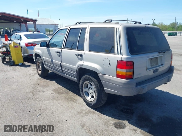 1996 Jeep Grand Cherokee Laredo with VIN 1J4FX58S2TC397006, listed as a IAAI auction lot 41836108 with 136,742 mi miles. Bid and sale history available at carsss.com. Image 3.