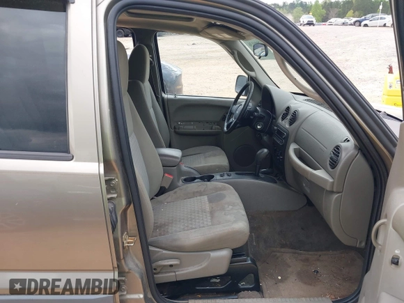 2005 Jeep Liberty Sport with VIN 1J4GL48K65W531365, listed as a IAAI auction lot 42004136 with 160,756 mi miles. Bid and sale history available at carsss.com. Image 5.