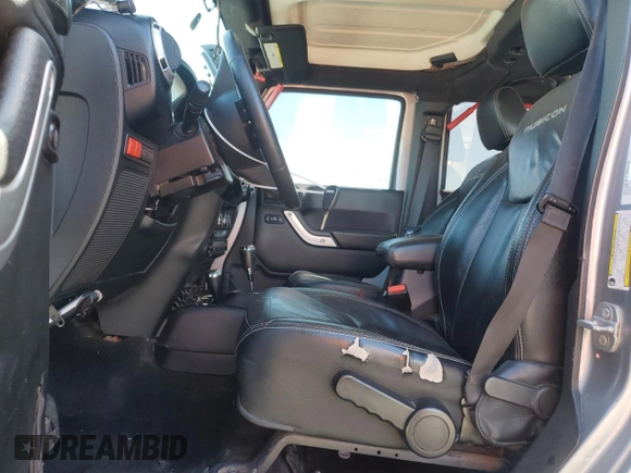 2014 Jeep Wrangler Unlimited Rubicon X with VIN 1C4BJWFG2EL308077, listed as a Copart auction lot 54439265 with 160,746 mi miles and Salvage title. Bid and sale history available at DreamBid. Image 7.