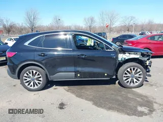 2020 Ford Escape Titanium z VIN 1FMCU9J98LUA44923, wystawiony jako IAAI lot #41779691 z przebiegiem 73 259 mil mil oraz . Historia ofert i sprzedaży dostępna na DreamBid. Obrazek 13.