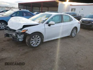 2019 Toyota Camry LE z VIN 4T1B11HK1KU804266, wystawiony jako IAAI lot #41226403 z przebiegiem 91 163 mil mil oraz . Historia ofert i sprzedaży dostępna na DreamBid. Obrazek 18.