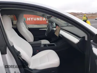 2023 Tesla Model Y Long Range with VIN 7SAYGDEE2PF874729, listed as a IAAI auction lot 41518376 with 10,927 mi miles and . Bid and sale history available at DreamBid. Image 5.