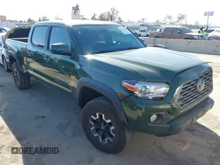 2021 Toyota Tacoma 4WD SR5 with VIN 3TMDZ5BN2MM101265, listed as a IAAI auction lot 41272874 with 51,989 mi miles. Bid and sale history available at carsss.com. Image 1.