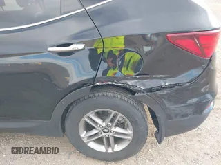 2017 Hyundai Santa Fe 2.4L z VIN 5XYZU3LB5HG425830, wystawiony jako IAAI lot #41428863 z przebiegiem 76 366 mil mil oraz . Historia ofert i sprzedaży dostępna na DreamBid. Obrazek 6.