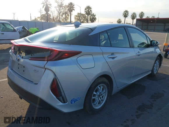 2021 Toyota Prius LE with VIN JTDKAMFP1M3196066, listed as a IAAI auction lot 41752179 with 90,200 mi miles and . Bid and sale history available at DreamBid. Image 4.