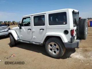 2014 Jeep Wrangler Unlimited Sahara with VIN 1C4BJWEG1EL210949, listed as a Copart auction lot 60977555 with 122,495 mi miles and Salvage title. Bid and sale history available at DreamBid. Image 2.