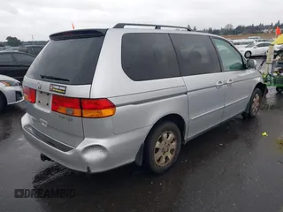 2004 Honda Odyssey EX-L with VIN 5FNRL18934B016420, listed as a IAAI auction lot 41473237 with 188,659 mi miles and . Bid and sale history available at DreamBid. Image 4.