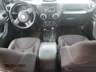 2013 Jeep Wrangler Unlimited Rubicon with VIN 1C4BJWFG5DL661282, listed as a Copart auction lot 57471035 with 128,400 mi miles and Salvage title. Bid and sale history available at DreamBid. Image 8.