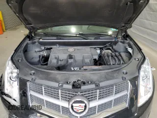 2012 Cadillac SRX Performance Collection with VIN 3GYFNEE3XCS593868, listed as a Copart auction lot 54381275 with 80,855 mi miles and Salvage title. Bid and sale history available at DreamBid. Image 12.