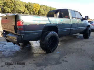 1999 Dodge Ram 2500 with VIN 1B7KC2368XJ548487, listed as a Copart auction lot 77256244 with 301,818 mi miles and Salvage Title. Bid and sale history available at carsss.com. Image 3.
