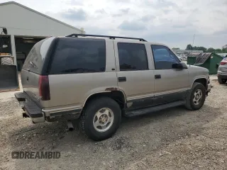 1999 Chevrolet Tahoe Z71 with VIN 1GNEK13R6XJ301562, listed as a Copart auction lot 59684595 with 200,561 mi miles and Salvage title. Bid and sale history available at DreamBid. Image 3.