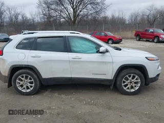2015 Jeep Cherokee North with VIN 1C4PJMCS6FW564435, listed as a IAAI auction lot 41992440 with 166,048 mi miles. Bid and sale history available at carsss.com. Image 13.