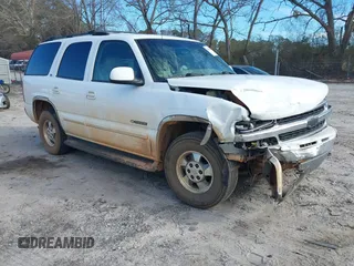 2002 Chevrolet Tahoe LS z VIN 1GNEC13Z52R329554, wystawiony jako IAAI lot #41629942 z przebiegiem 232 374 mil mil oraz . Historia ofert i sprzedaży dostępna na DreamBid. Obrazek 1.
