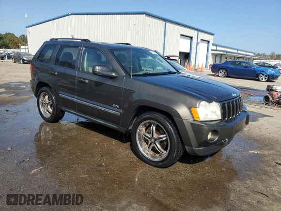 2006 Jeep Grand Cherokee Laredo with VIN 1J4HS48N96C357909, listed as a Copart auction lot 77551154 with 136,235 mi miles and Salvage Title. Bid and sale history available at carsss.com. Image 4.