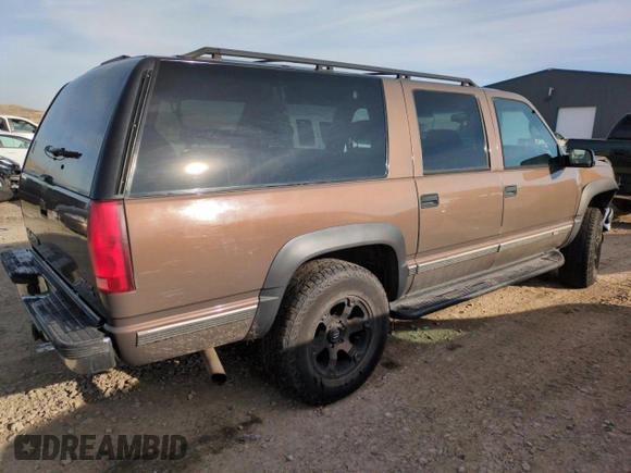 1998 GMC Suburban z VIN 3GKFK16R4WG507685, wystawiony jako Copart lot #87900735 z przebiegiem 183 033 mil mil oraz Szkoda całkowita • Salvage title. Historia ofert i sprzedaży dostępna na DreamBid. Obrazek 3.