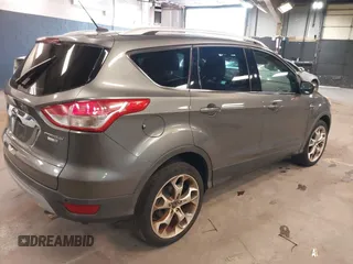 2014 Ford Escape Titanium with VIN 1FMCU9JX0EUE45254, listed as a IAAI auction lot 42038700 with 60,103 mi miles. Bid and sale history available at carsss.com. Image 4.