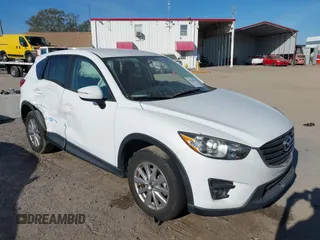 2016 Mazda CX-5 Touring z VIN JM3KE2CY9G0826242, wystawiony jako IAAI lot #41444024 z przebiegiem Nie podano mil oraz . Historia ofert i sprzedaży dostępna na DreamBid. Obrazek 1.