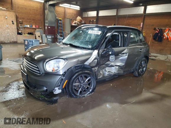 2014 MINI Countryman with VIN WMWZB3C59EWR42124, listed as a Copart auction lot 57830395 with 125,000 mi miles and Salvage title. Bid and sale history available at DreamBid. Image 1.