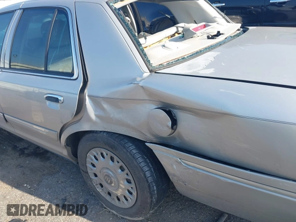 2004 Mercury Grand Marquis GS with VIN 2MEFM74W34X677247, listed as a IAAI auction lot 41856970 with 135,225 mi miles and . Bid and sale history available at DreamBid. Image 6.