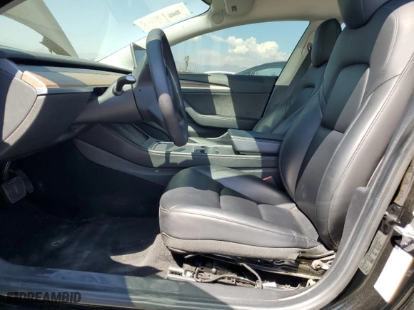 2021 Tesla Model 3 Standard Range Plus with VIN 5YJ3E1EAXMF069467, listed as a Copart auction lot 63273134 with 66,393 mi miles and Salvage Title. Bid and sale history available at carsss.com. Image 7.