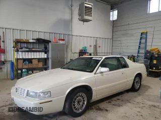 2001 Cadillac Eldorado Touring ETC z VIN 1G6ET12911B106819, wystawiony jako Copart lot #55480155 z przebiegiem 97 422 mil mil oraz Szkody całkowita. Historia ofert i sprzedaży dostępna na DreamBid. Obrazek 1.