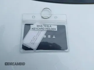 2022 Tesla Model Y Long Range with VIN 7SAYGDEE1NF421098, listed as a IAAI auction lot 42177555 with 55,855 mi miles and . Bid and sale history available at carsss.com. Image 11.