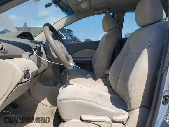 2009 Toyota Yaris with VIN JTDBT903591302633, listed as a Copart auction lot 53512185 with 351,622 mi miles and Salvage Title. Bid and sale history available at carsss.com. Image 7.