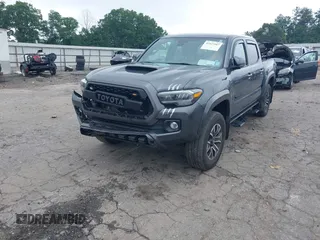 2022 Toyota Tacoma SR with VIN 3TMCZ5AN2NM507478, listed as a IAAI auction lot 42425907 with 40,796 mi miles and . Bid and sale history available at DreamBid. Image 2.