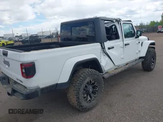 2021 Jeep Gladiator High Altitude z VIN 1C6HJTFG2ML567988, wystawiony jako IAAI lot #42103576 z przebiegiem 74 849 mil mil oraz . Historia ofert i sprzedaży dostępna na DreamBid. Obrazek 4.