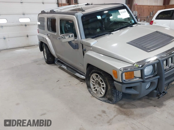 2006 Hummer H3 with VIN 5GTDN136268123052, listed as a IAAI auction lot 42126283 with 124,040 mi miles. Bid and sale history available at carsss.com. Image 6.