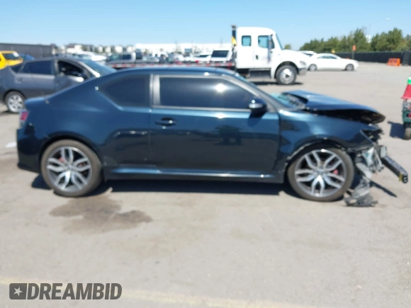 2015 Scion tC with VIN JTKJF5C77F3094936, listed as a IAAI auction lot 41830668 with 89,727 mi miles. Bid and sale history available at carsss.com. Image 14.