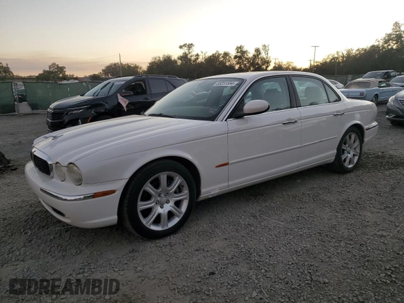 2004 Jaguar XJ with VIN SAJWA71C14SG16264, listed as a Copart auction lot 83251554 with 267,493 mi miles and Salvage Title. Bid and sale history available at carsss.com. Image 1.
