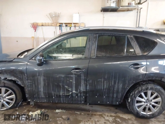 2015 Mazda CX-5 Touring with VIN JM3KE2CY2F0458114, listed as a IAAI auction lot 41545493 with 138,061 mi miles. Bid and sale history available at carsss.com. Image 15.