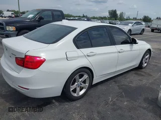 2013 BMW 3 Series 328i with VIN WBA3A5G51DNP26142, listed as a IAAI auction lot 41767977 with 129,440 mi miles. Bid and sale history available at carsss.com. Image 4.