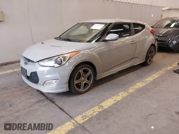 2013 Hyundai Veloster w/Black Int with VIN KMHTC6AD2DU128534, listed as a IAAI auction lot 41791398 with 158,414 mi miles and . Bid and sale history available at DreamBid. Image 2.