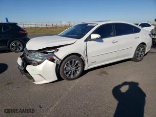 2016 Toyota Avalon Hybrid XLE Premium with VIN 4T1BD1EB7GU056738, listed as a Copart auction lot 77008243 with 130,760 mi miles. Bid and sale history available at carsss.com. Image 1.