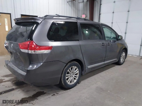 2012 Toyota Sienna XLE AAS with VIN 5TDYK3DC9CS268758, listed as a IAAI auction lot 41613513 with 214,601 mi miles. Bid and sale history available at carsss.com. Image 4.