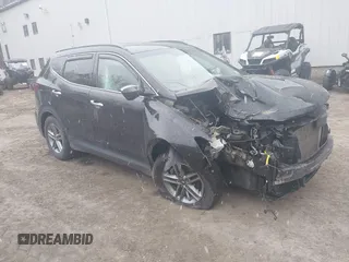 2018 Hyundai Santa Fe 2.4L z VIN 5NMZUDLB7JH098638, wystawiony jako IAAI lot #42055793 z przebiegiem 63 516 mil mil oraz . Historia ofert i sprzedaży dostępna na DreamBid. Obrazek 1.