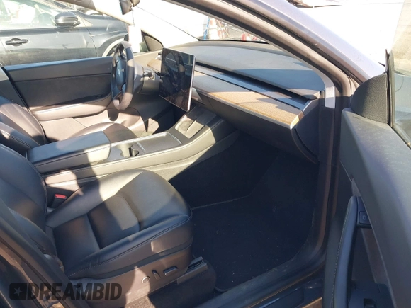 2021 Tesla Model Y Long Range with VIN 5YJYGAEE1MF149887, listed as a IAAI auction lot 42032104 with 54,932 mi miles. Bid and sale history available at carsss.com. Image 5.