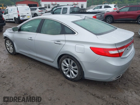 2014 Hyundai Azera Limited with VIN KMHFH4JG1EA424547, listed as a IAAI auction lot 42352357 with 47,242 mi miles and . Bid and sale history available at DreamBid. Image 3.
