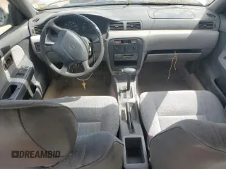 1996 Nissan Sentra XE z VIN 3N1AB41DXTL004753, wystawiony jako Copart lot #47585125 z przebiegiem 239 957 mil mil oraz Szkoda całkowita • Salvage title. Historia ofert i sprzedaży dostępna na DreamBid. Obrazek 8.