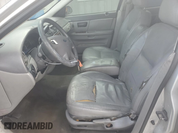 2003 Ford Taurus z VIN 1FAHP59U73A217826, wystawiony jako Copart lot #80059964 z przebiegiem 315 560 mil mil oraz Szkody całkowita. Historia ofert i sprzedaży dostępna na DreamBid. Obrazek 7.
