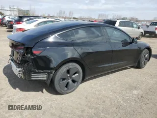 2021 Tesla Model 3 Standard Range Plus with VIN 5YJ3E1EA7MF053663, listed as a Copart auction lot 51982265 with 90,529 mi miles and Salvage Title. Bid and sale history available at DreamBid. Image 3.