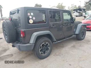 2014 Jeep Wrangler Unlimited Sport with VIN 1C4BJWDG7EL244749, listed as a IAAI auction lot 41871127 with 128,420 mi miles and . Bid and sale history available at DreamBid. Image 4.