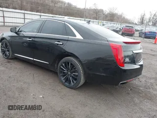 2014 Cadillac XTS Platinum with VIN 2G61W5S84E9291640, listed as a IAAI auction lot 41877867 with 100,462 mi miles and . Bid and sale history available at DreamBid. Image 3.