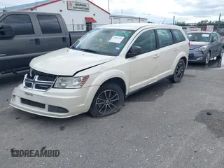 2014 Dodge Journey SE with VIN 3C4PDCAB1ET192530, listed as a IAAI auction lot 41987728 with 186,486 mi miles and . Bid and sale history available at carsss.com. Image 2.